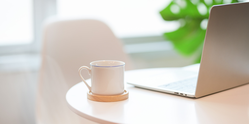 White Cup Near Laptop.jpg